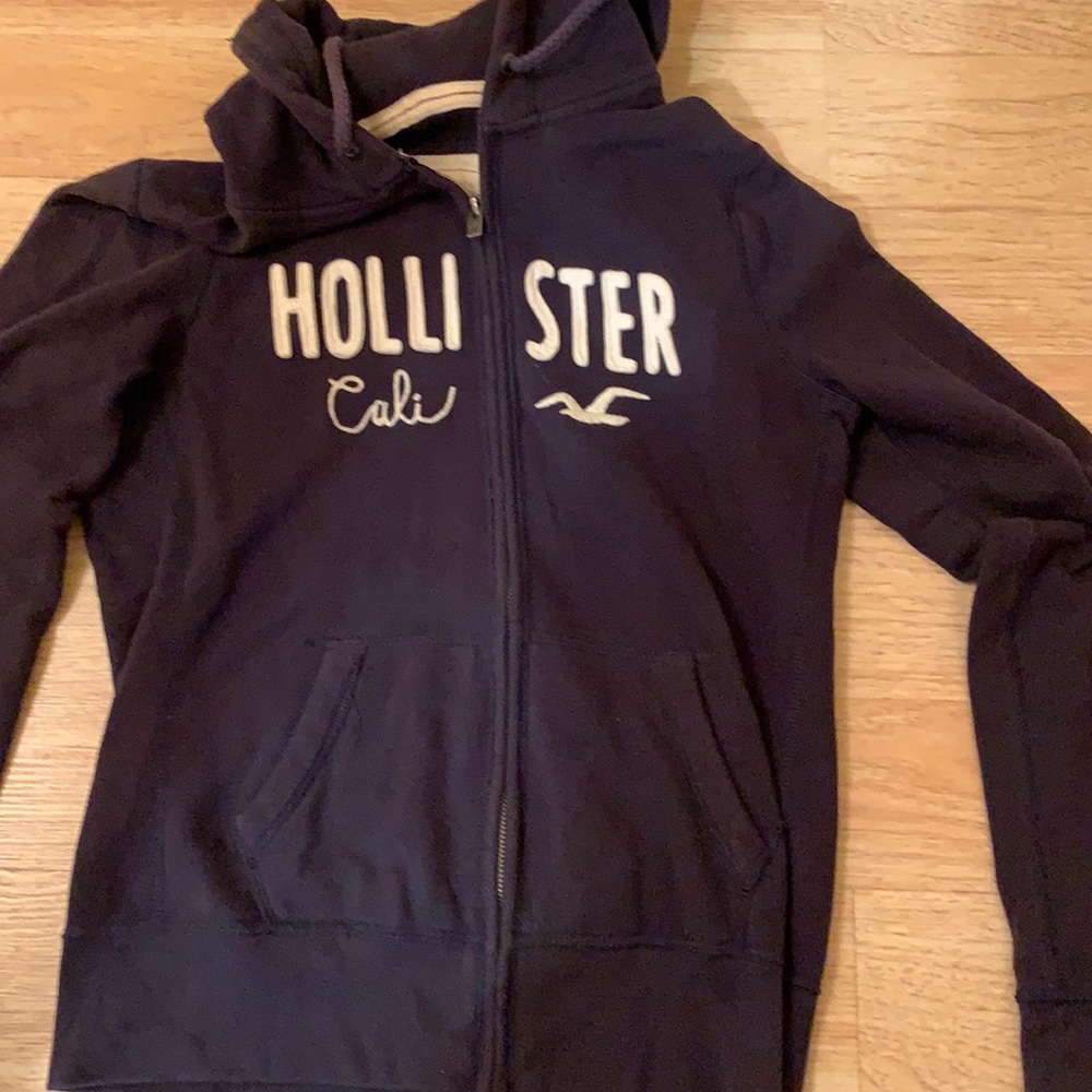 Hollister Hoodie in navy blue. Size large but fits smaller.